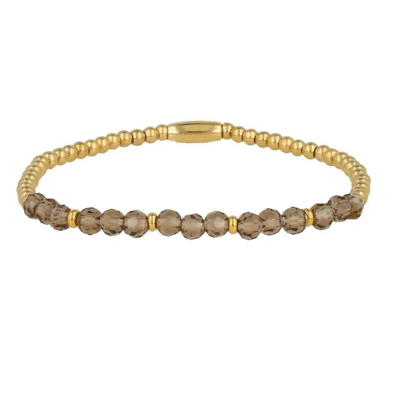 Gouden armband met groene glaskristallen