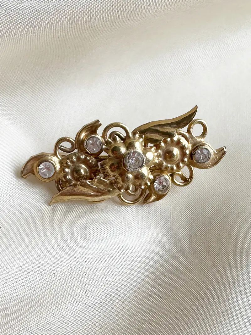 Gouden broche met strass