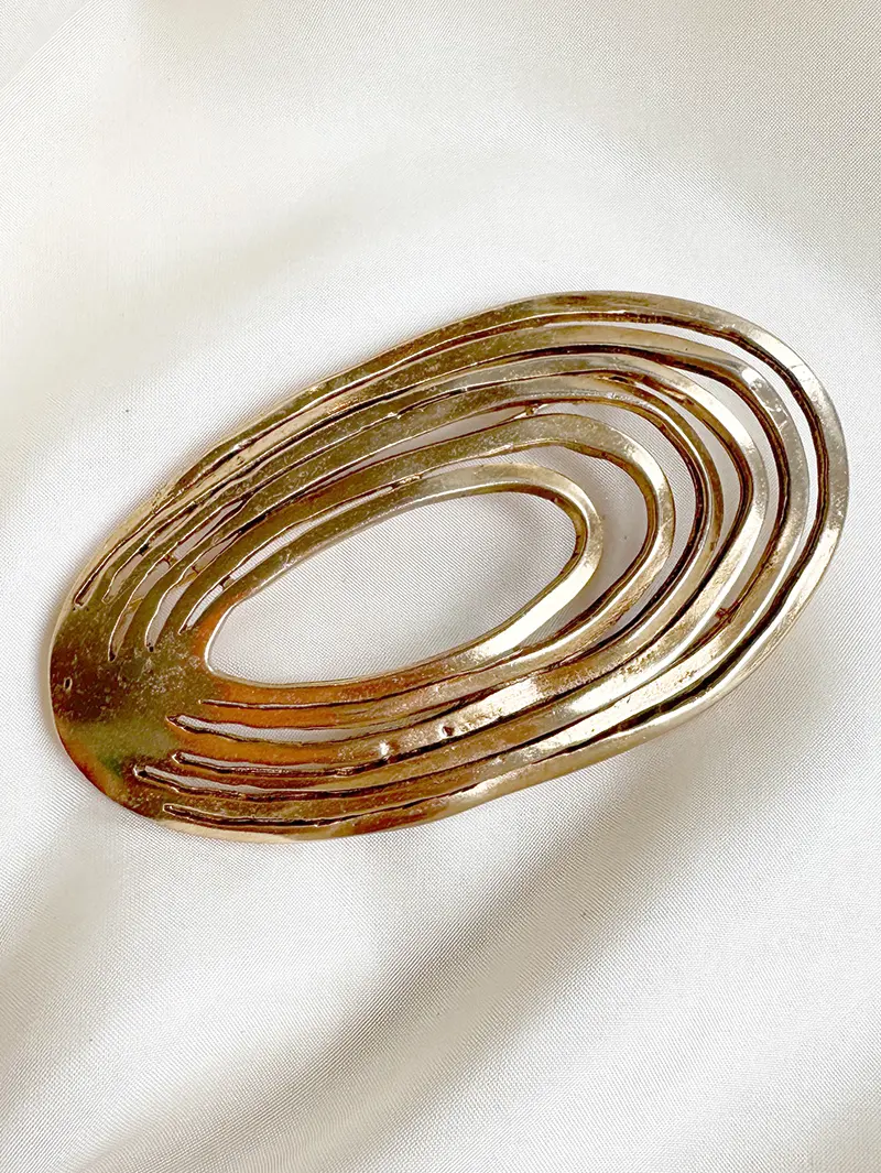 Grote vergulde designer broche