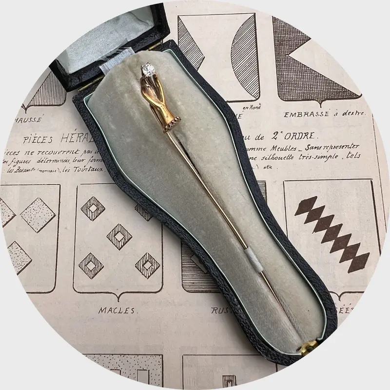 Hand Holding a Diamond Stickpin