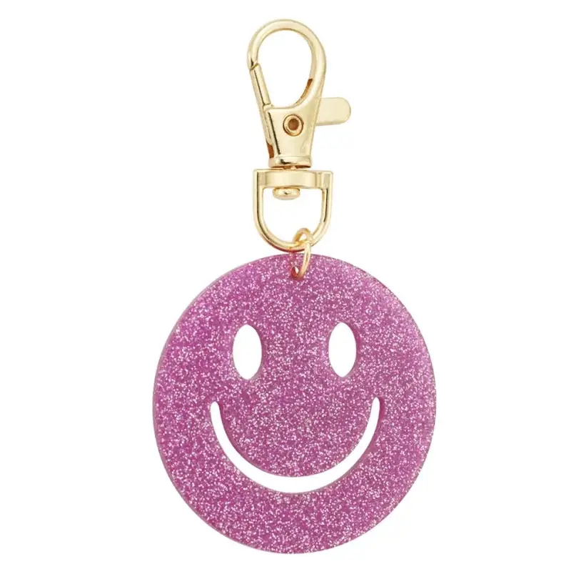 Sleutelhanger Keep Smiling goud fuchsia