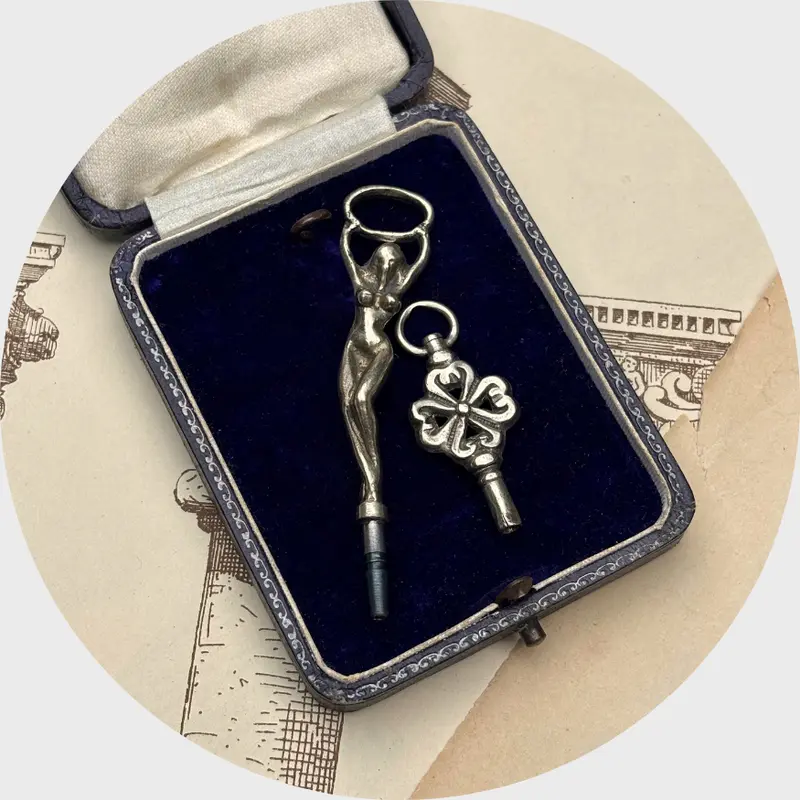 Two Silver Watch Key Pendants, Flower and Lady