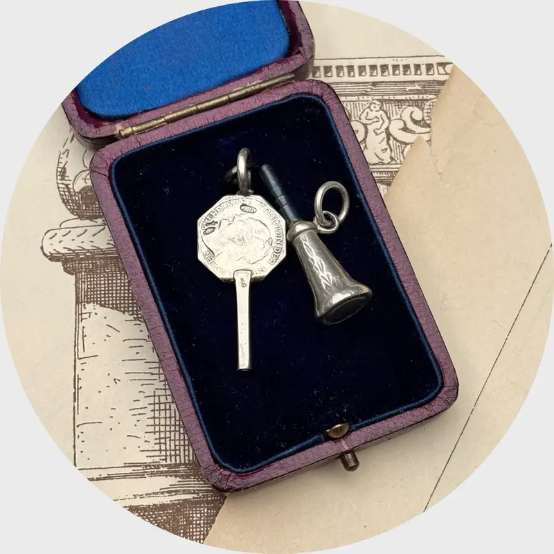Two Silver Watch Key Pendants, including a Wilhelmina Key